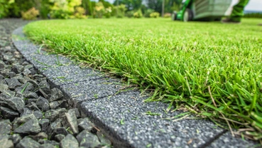 Artificial turf base cleanup before synthetic grass installation in Dallas