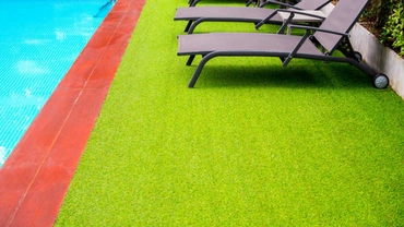 Luxury poolside artificial turf installation at a Dallas home